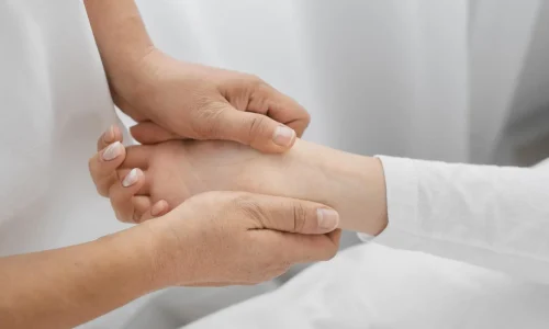 osteopathist-treating-patient-s-arms-close-up